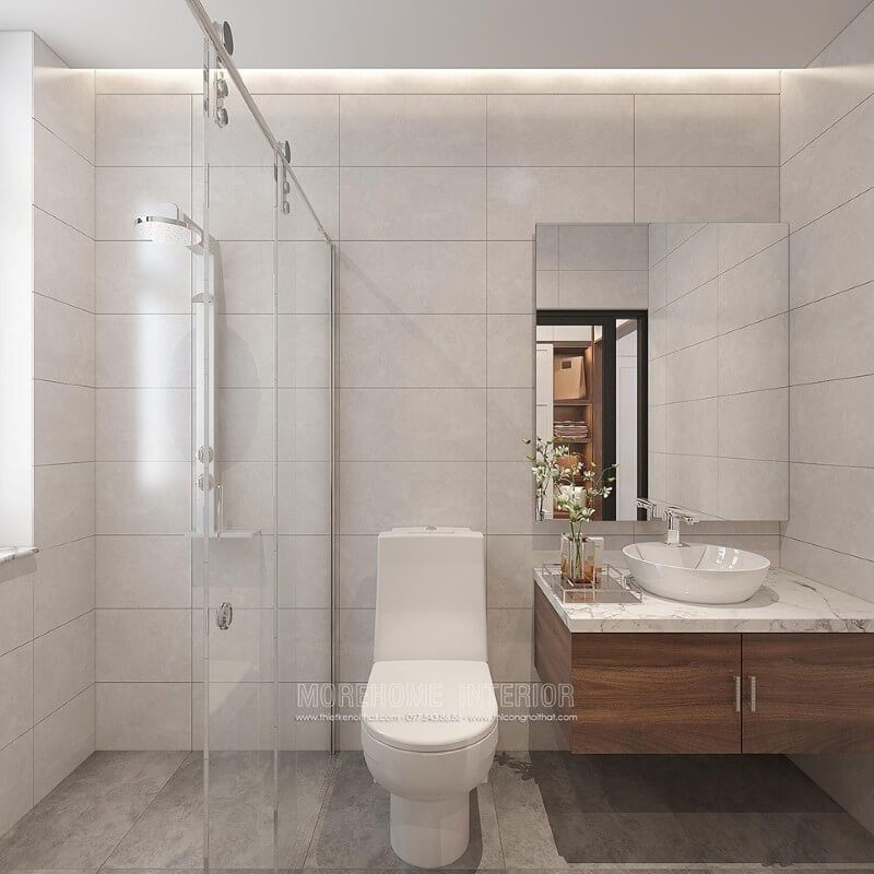 Mẫu thiết kế phòng tắm nhỏ đẹp này sẽ mang lại cho bạn những ý tưởng thú vị về cách bố trí hợp lý. Phòng tắm có cửa kính trượt giúp làm cho căn phòng trở nên thông thoáng. Gạch ốp tường từ đá giả màu bê tông cũng là một phần không thể thiếu trong thiết kế này.