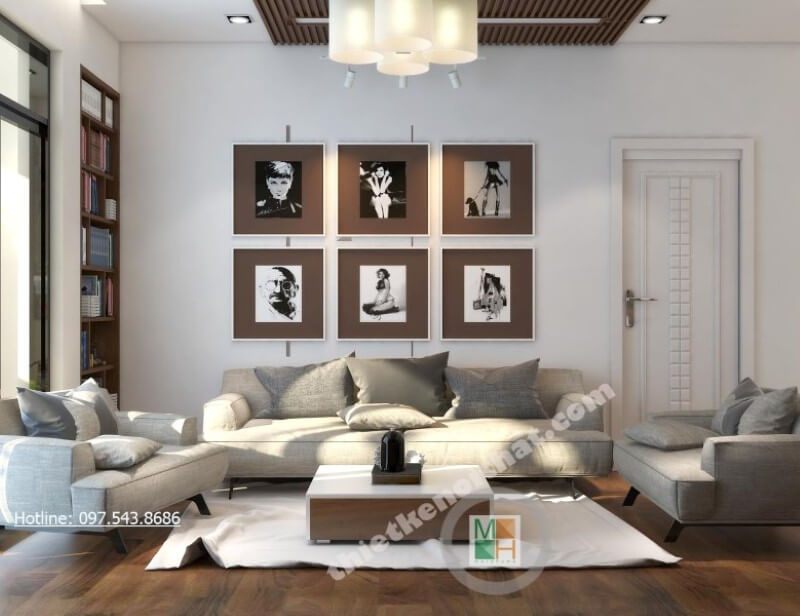 Không còn là những mảng tường đơn sắc thiếu tinh tế, kiến trúc sư lựa chọn trang trí thêm bằng những bức tranh treo tường canvas đầy lạ mắt